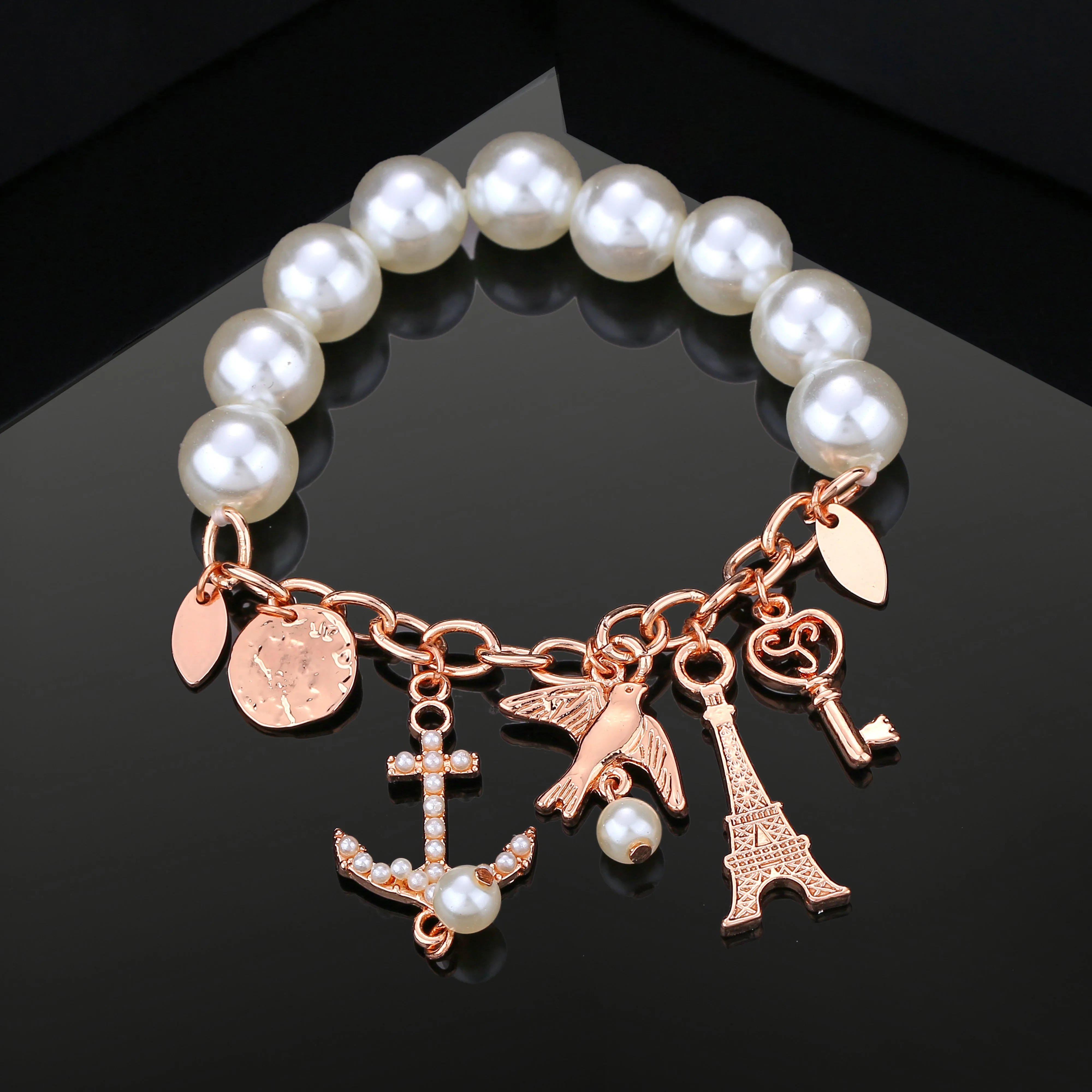 Estele Rosegold Plated Pearl Bracelet with Multiple travel Charms